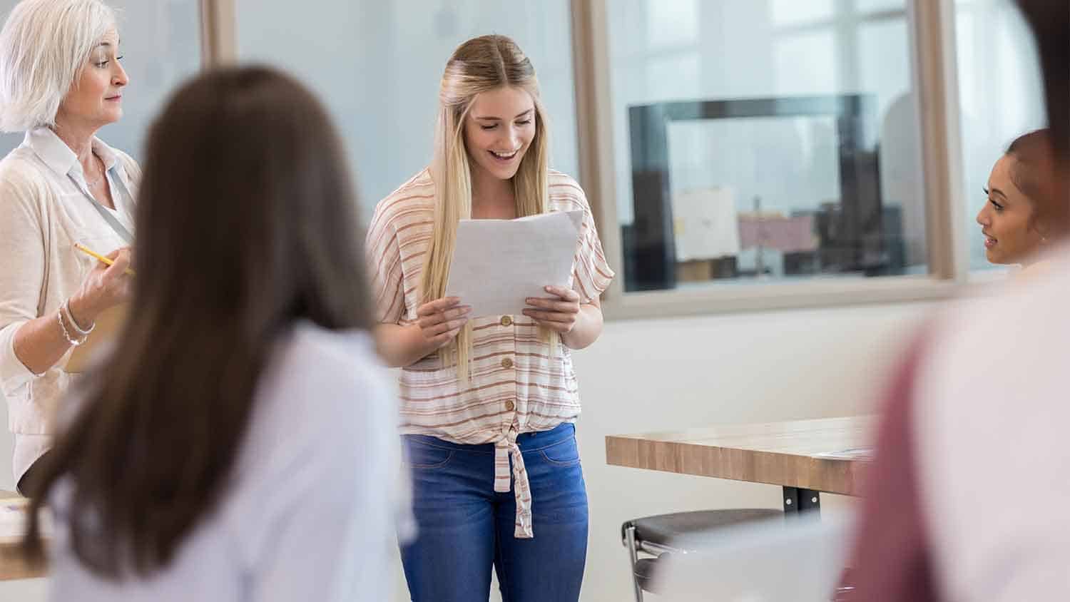 Woman reading out in a teaching setting