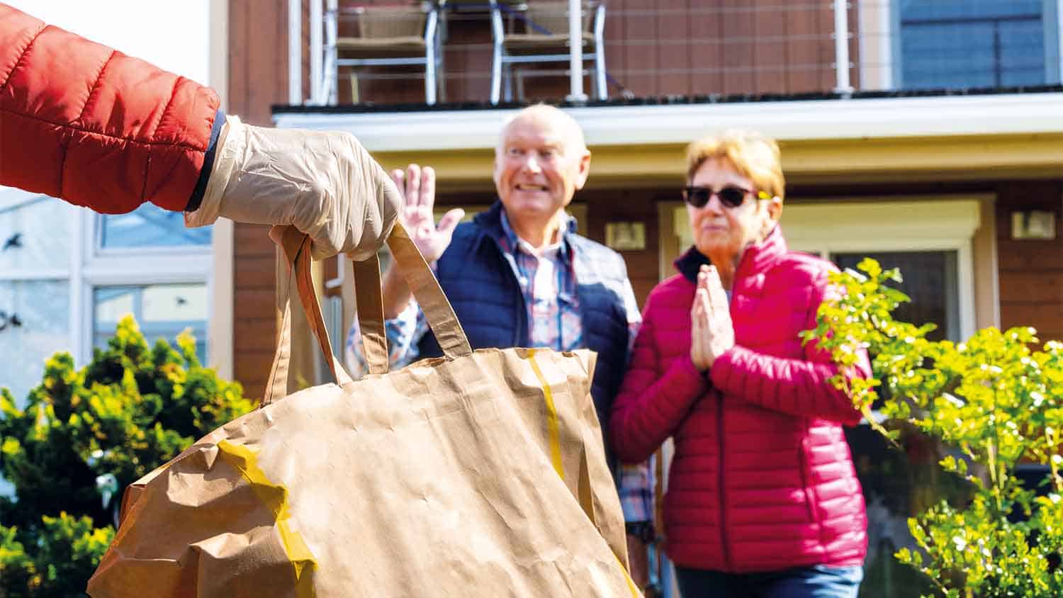 Older couple gratefully receiving provisions