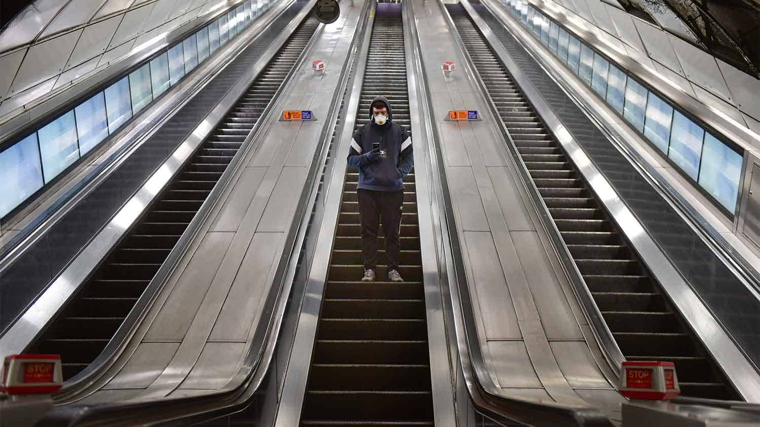 Man stood on an escalator