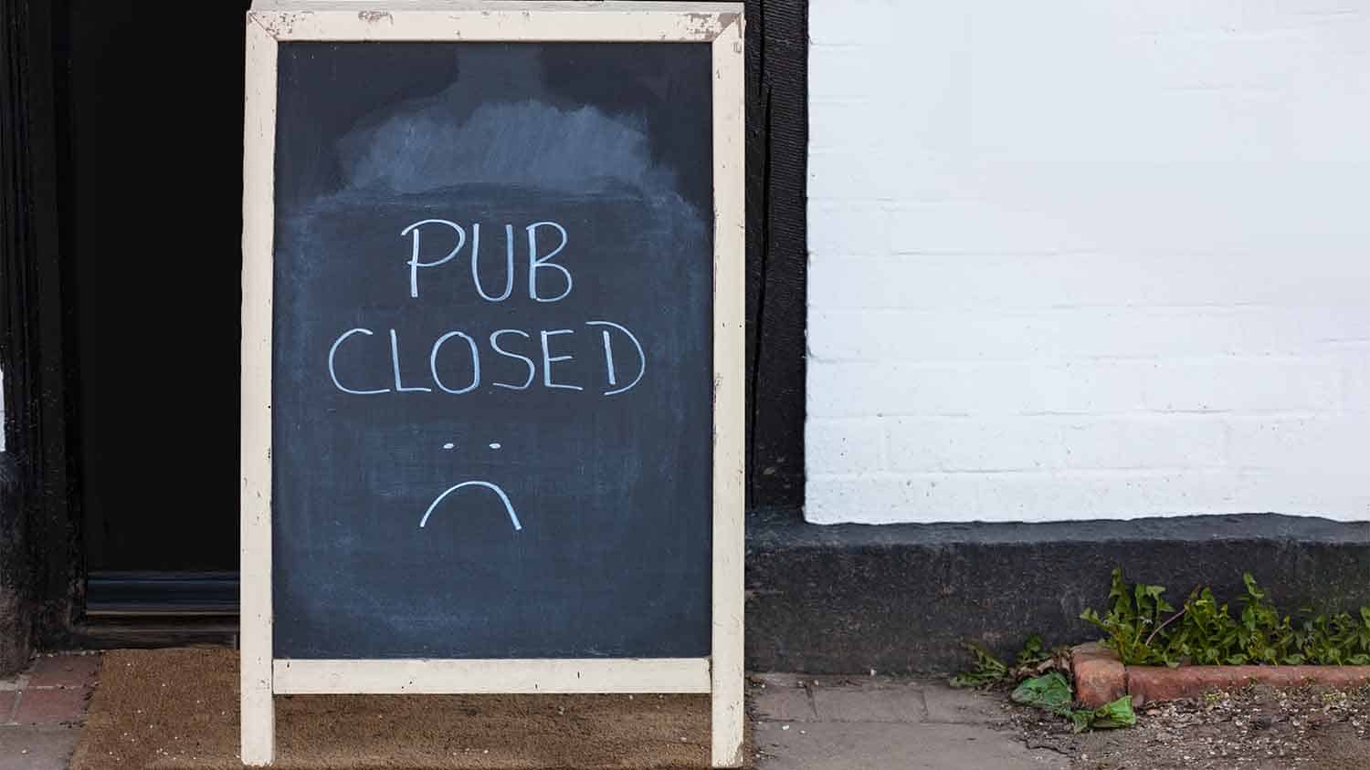 A sign saying 'pub closed'