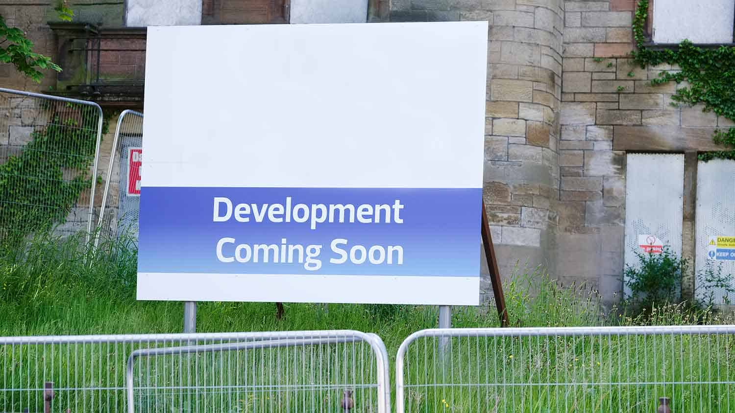 Housing development sign outside a building site