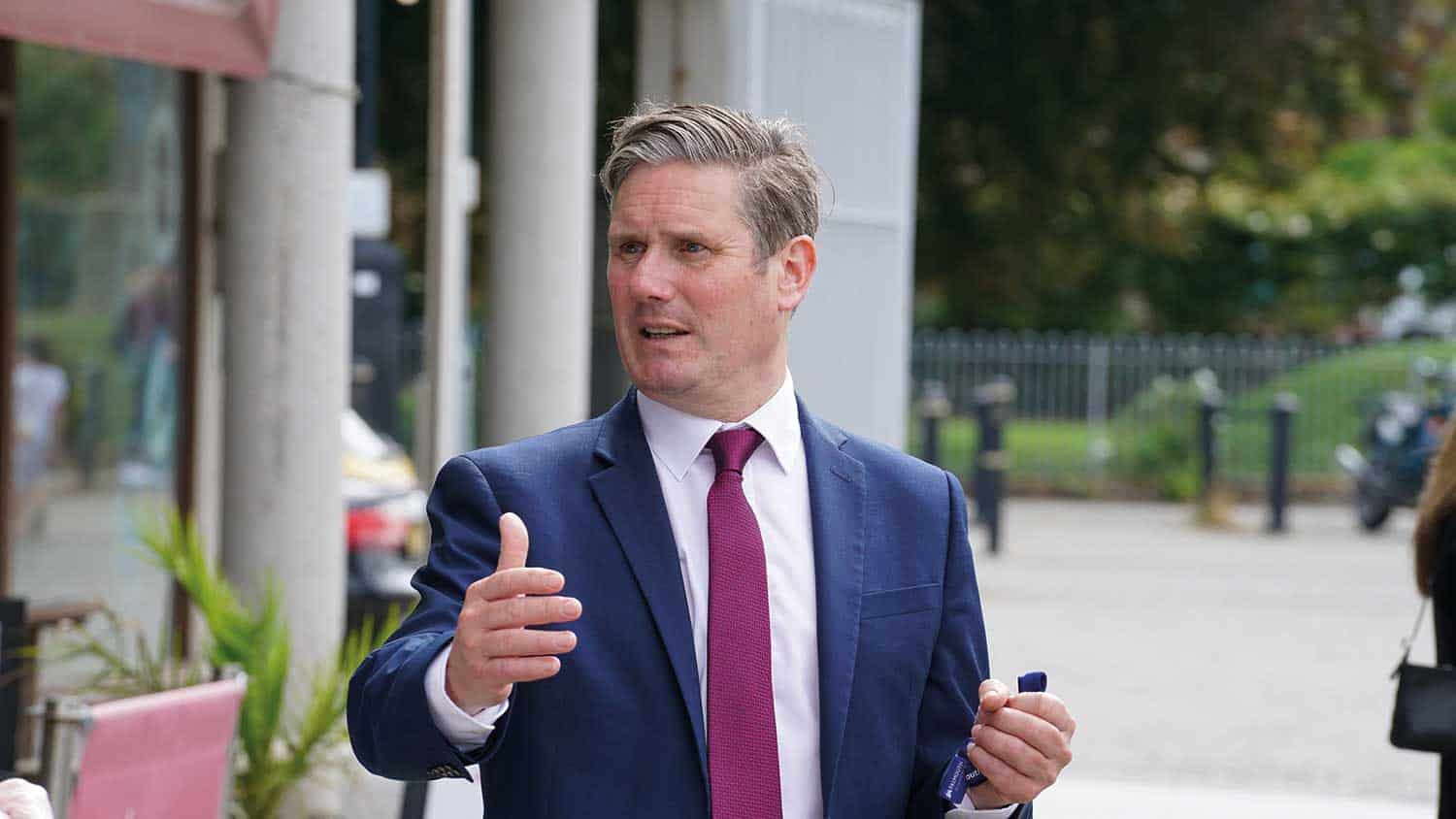 The Labour leader Sir Keir Starmer animate iwth his hands talking to someone off camera