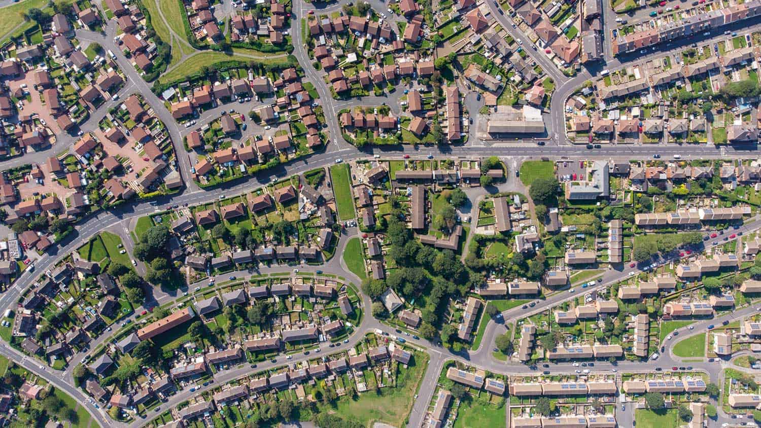 Arial view of streets, roads and houses show like a maze