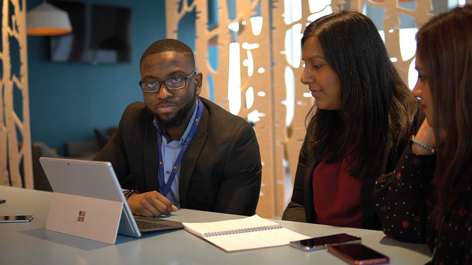 NGDP trainee looking at a computer with an assessor