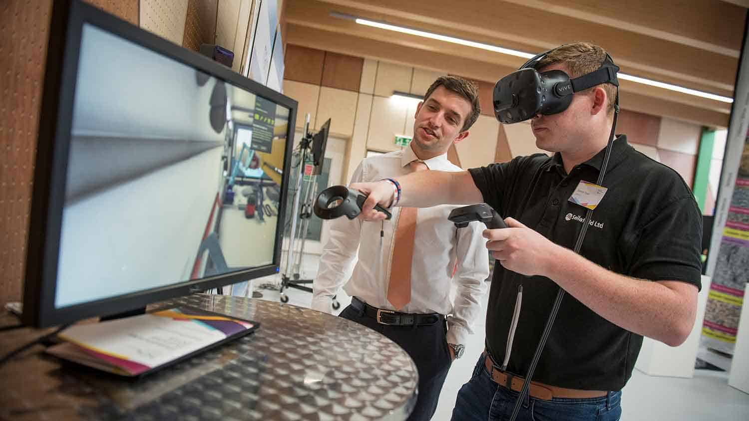 Someone being shown by a salesman a VR headset and controllers