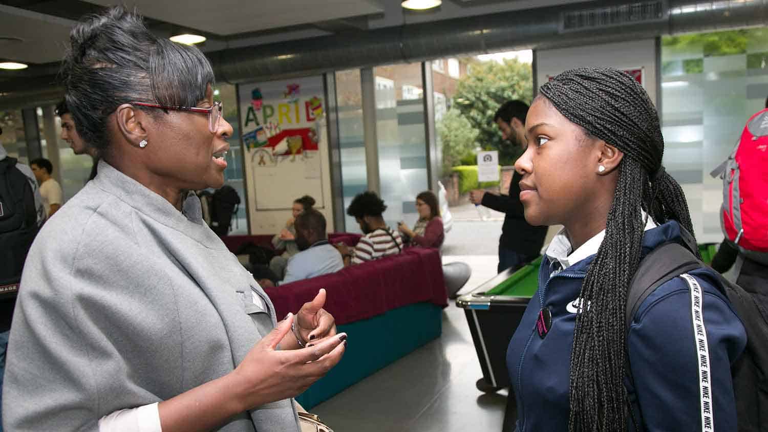 Cllr Bramble talking to a school pupil