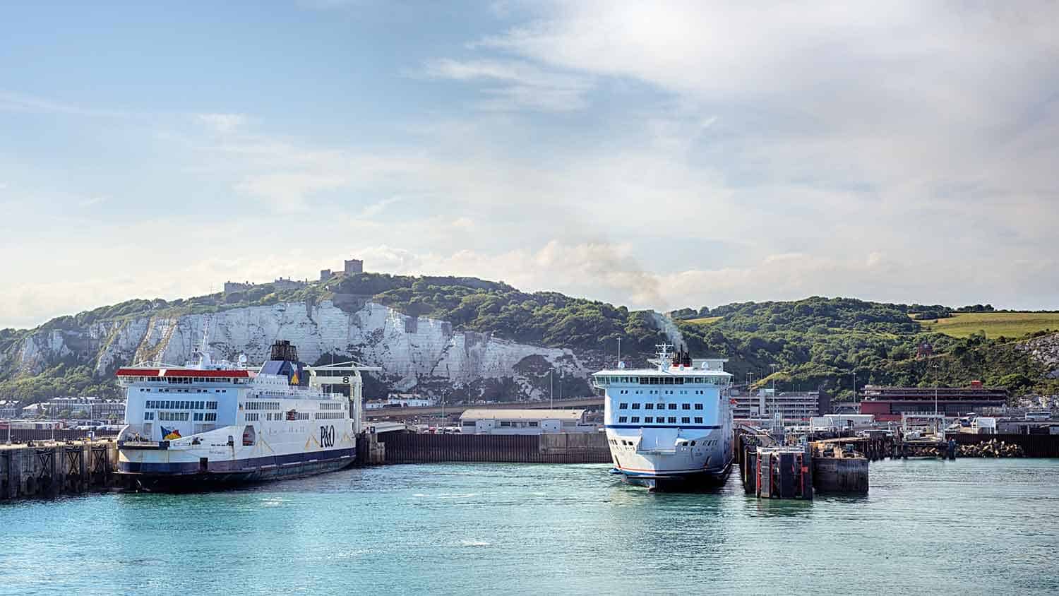 Several large boats docked at a port