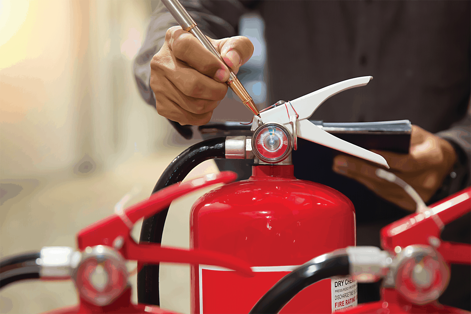 Someone measuring an extinguisher fluid