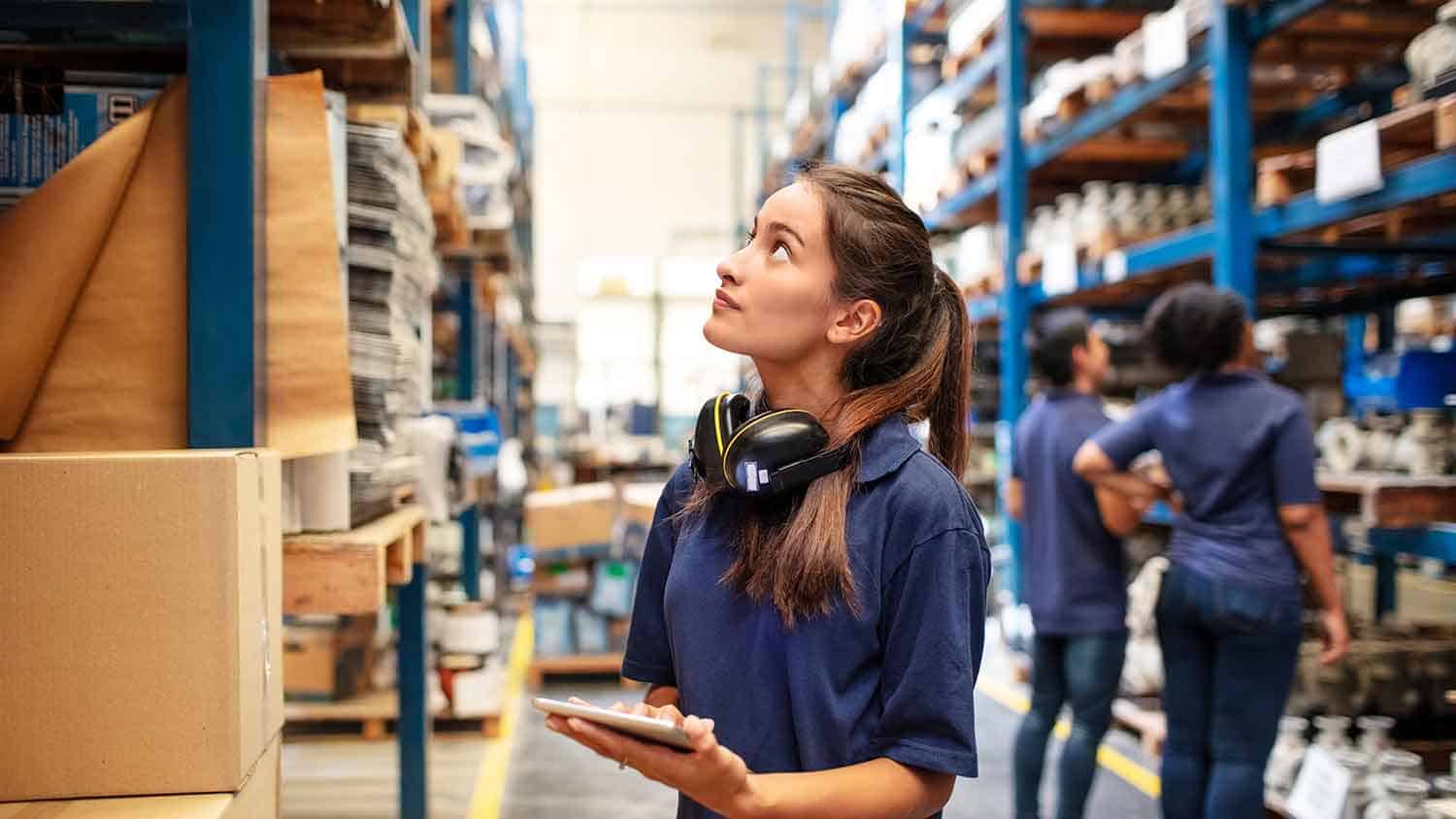 Warehouse worker looking for produce to pick