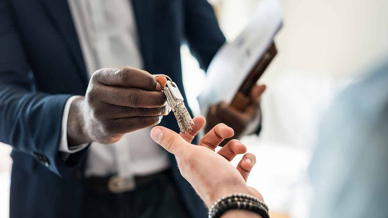 Keys to a house being handed over