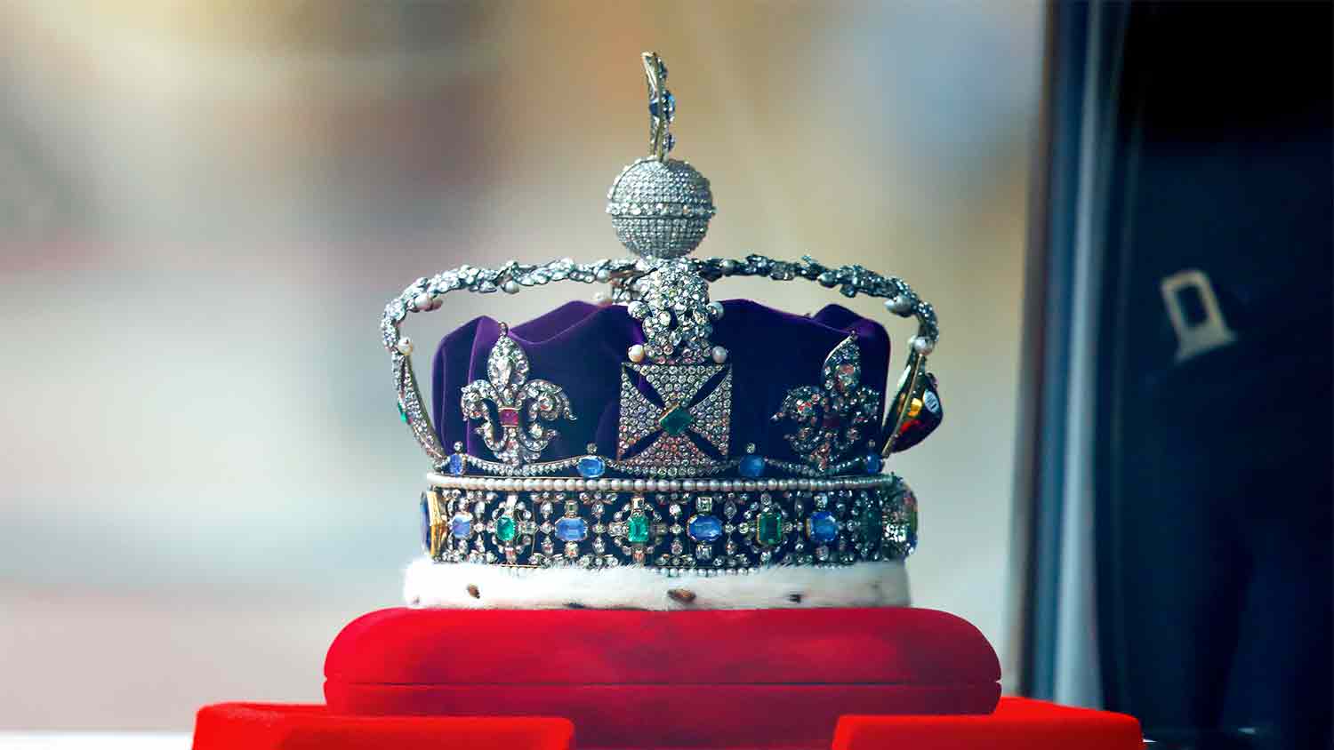 The crown jewels sat on a red velvet display unit