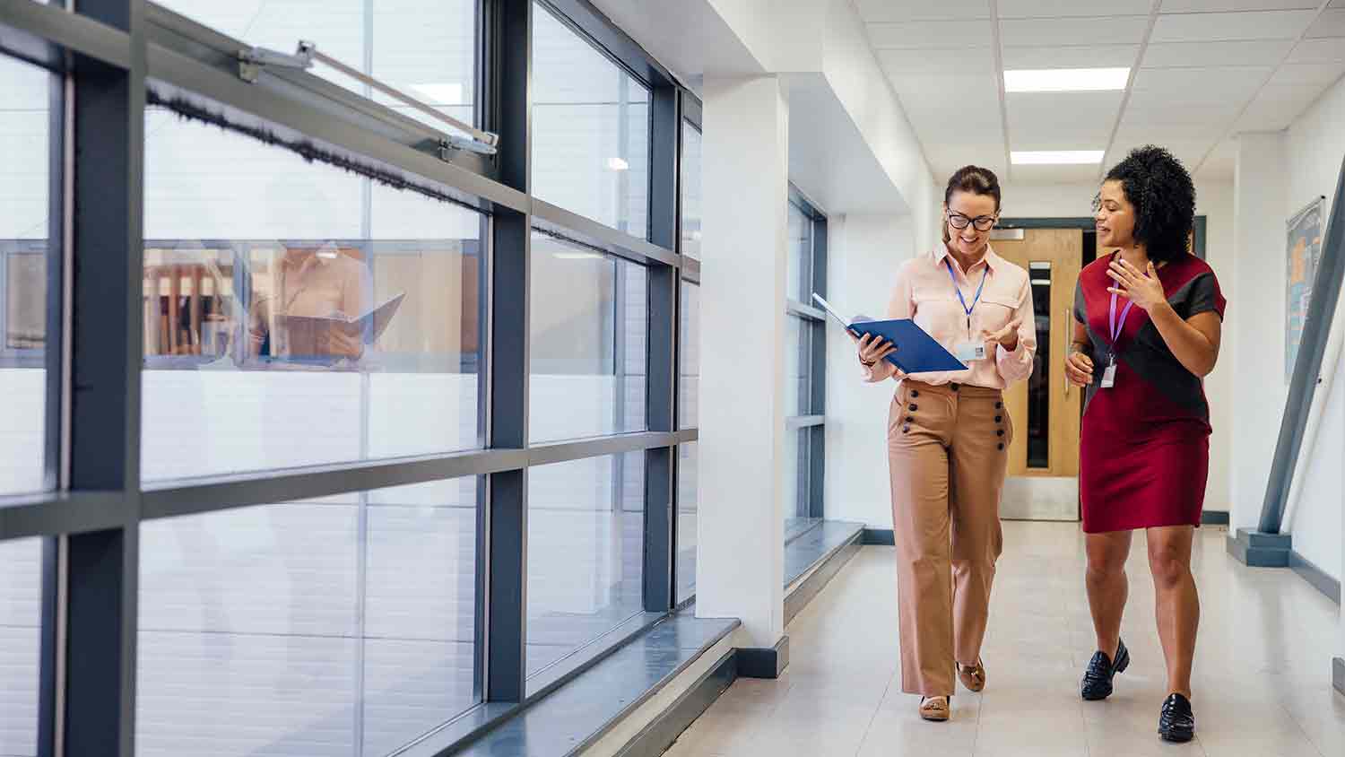 office workers talking in a corridor