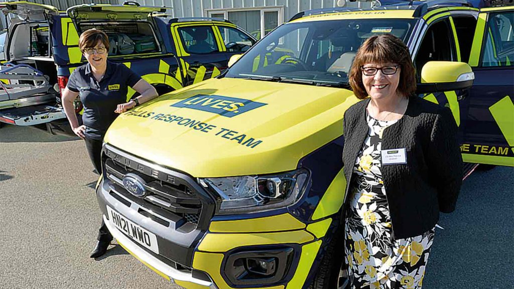 Councillor Patricia Bradwell stood in front of an ambulance