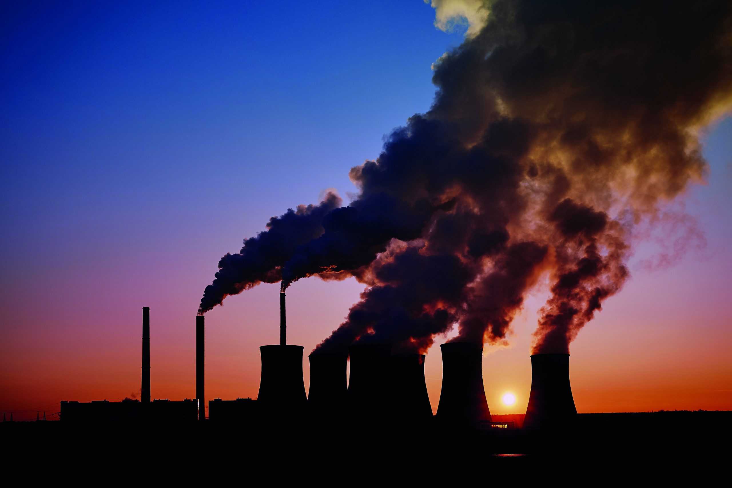 coal fired power station silhouette at sunset, Pocerady, Czech republic