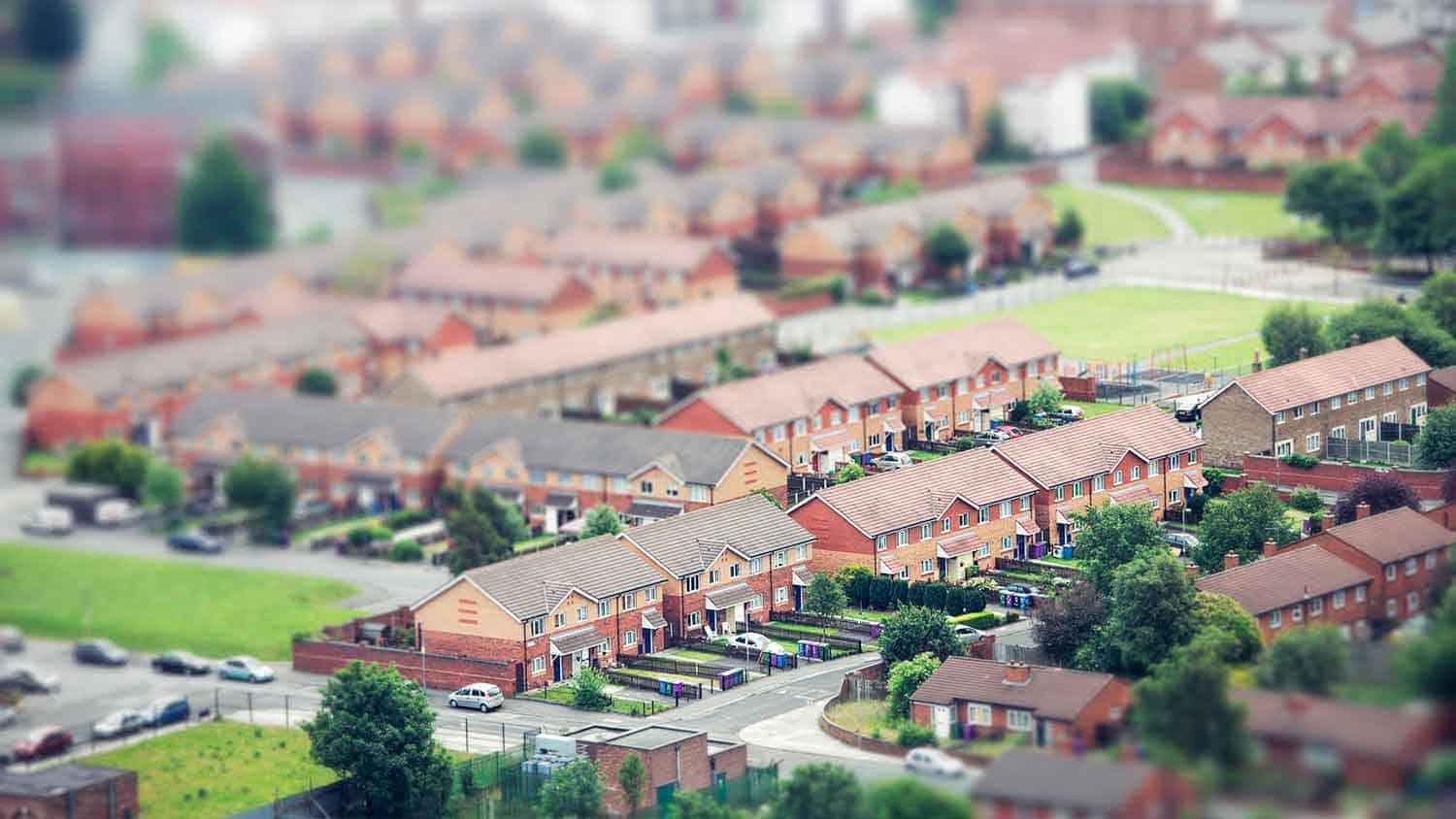 an overhead view of a town spralling across the countryside