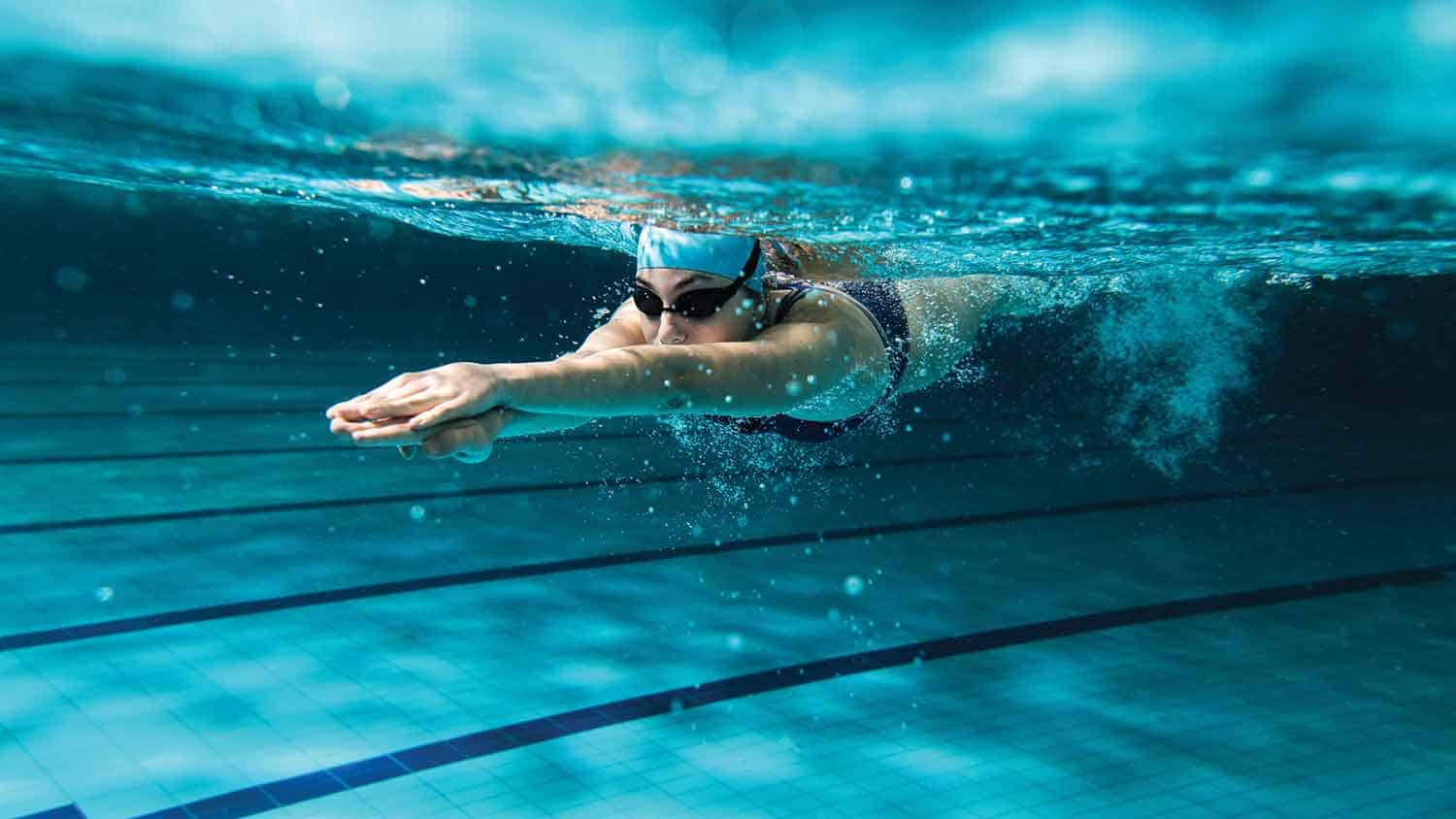 Swimmer under water, pushing off or diving in.