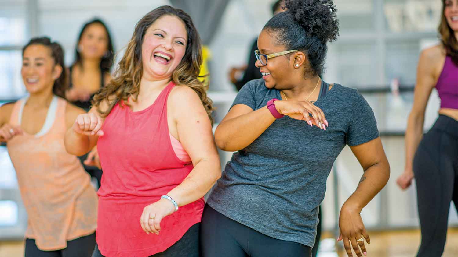 Two women enjoying a zumba class