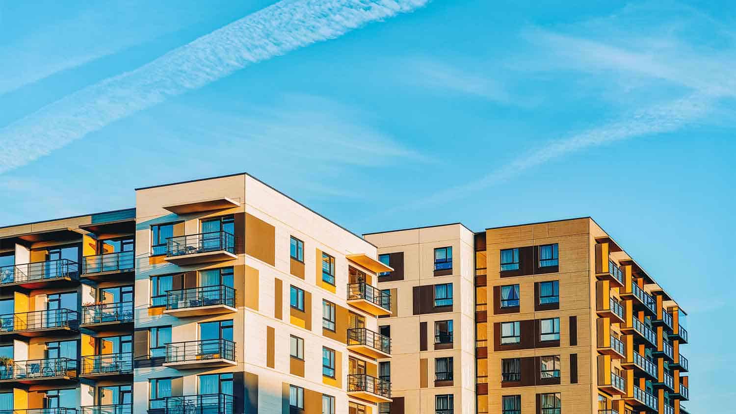 Apartment blocks with a blue sky background