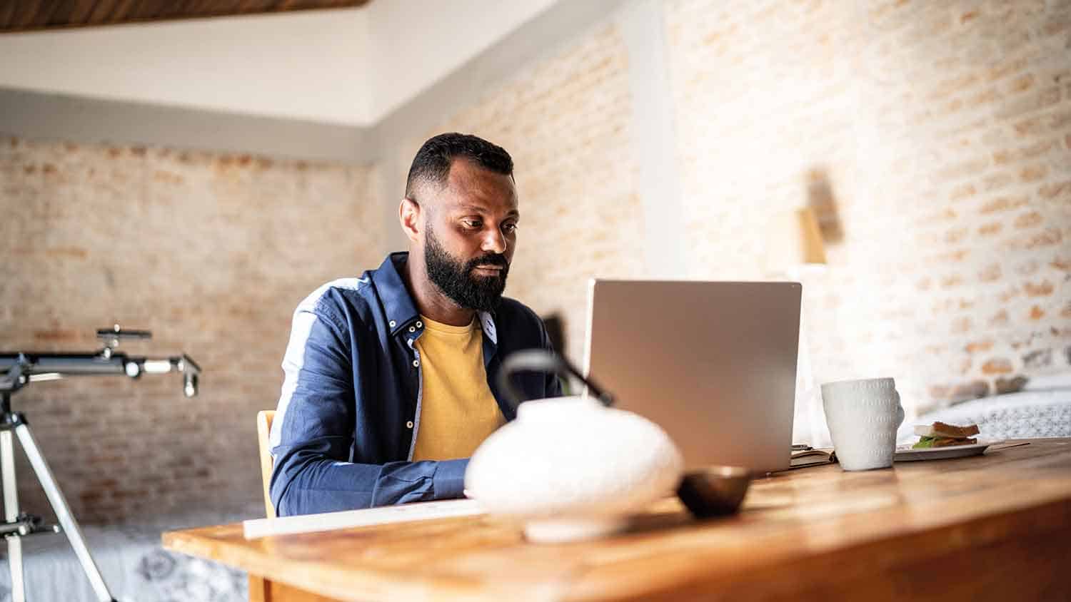 Man working at a computer in a home office