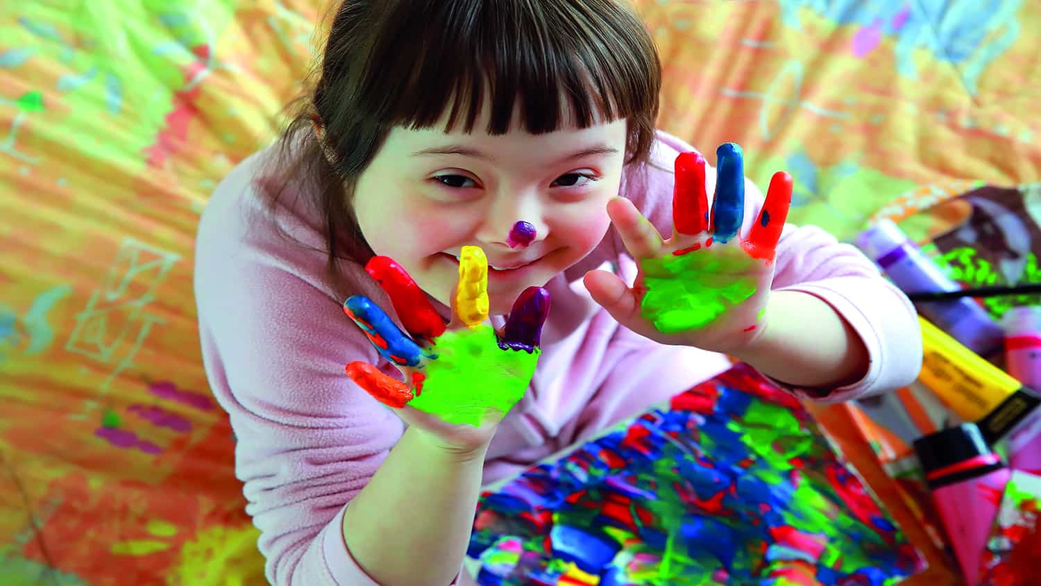 Little girl with painted hands