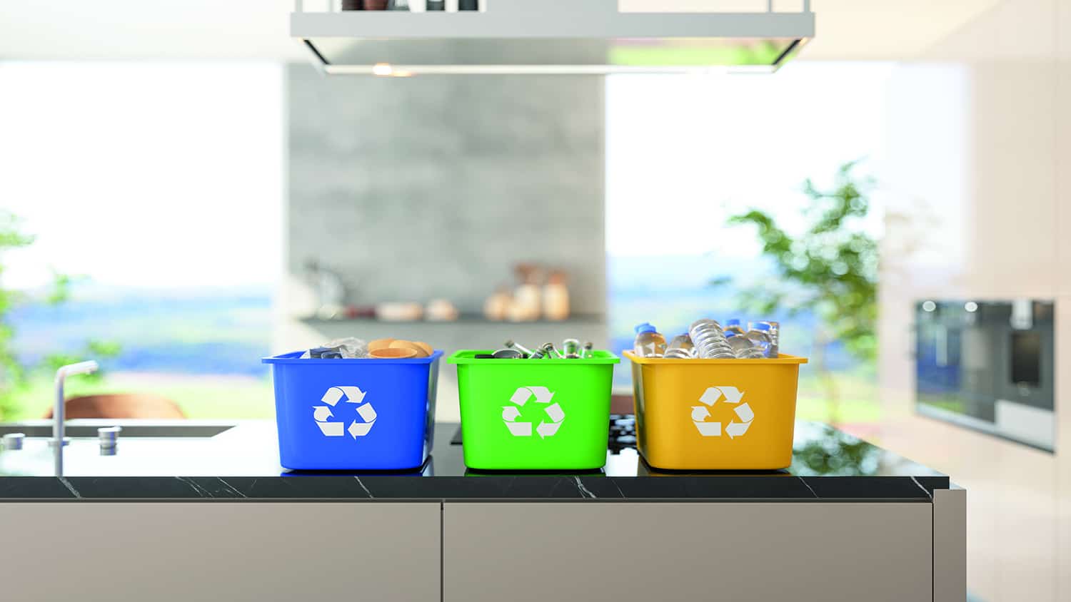 Recycling bins on kitchen island with blurred kitchen background