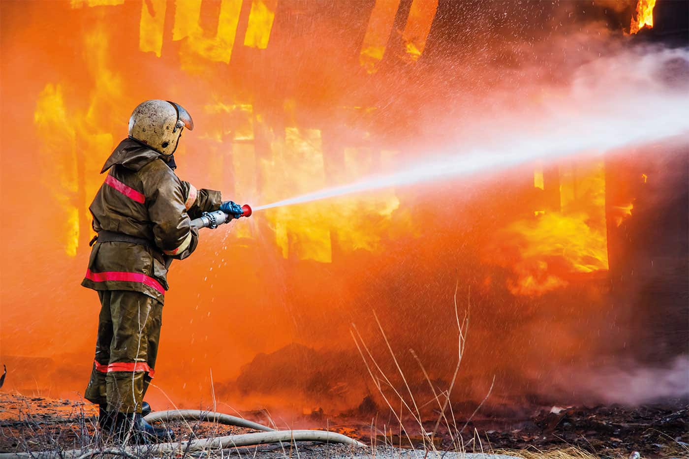 A firefighter putting out a fire