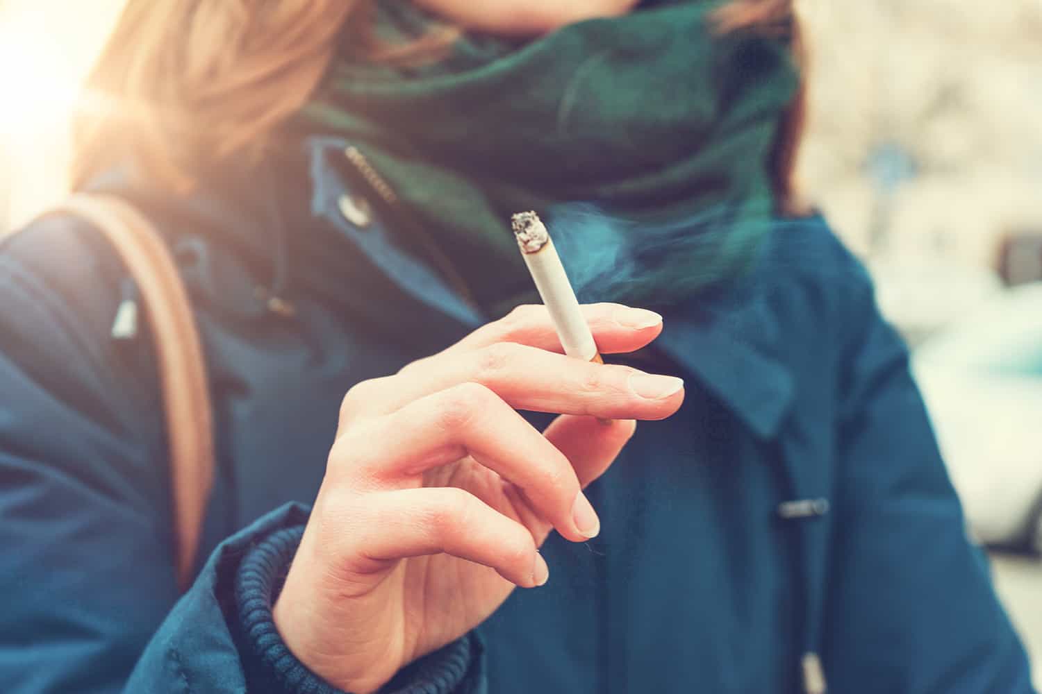 Young woman smoking a cigarette