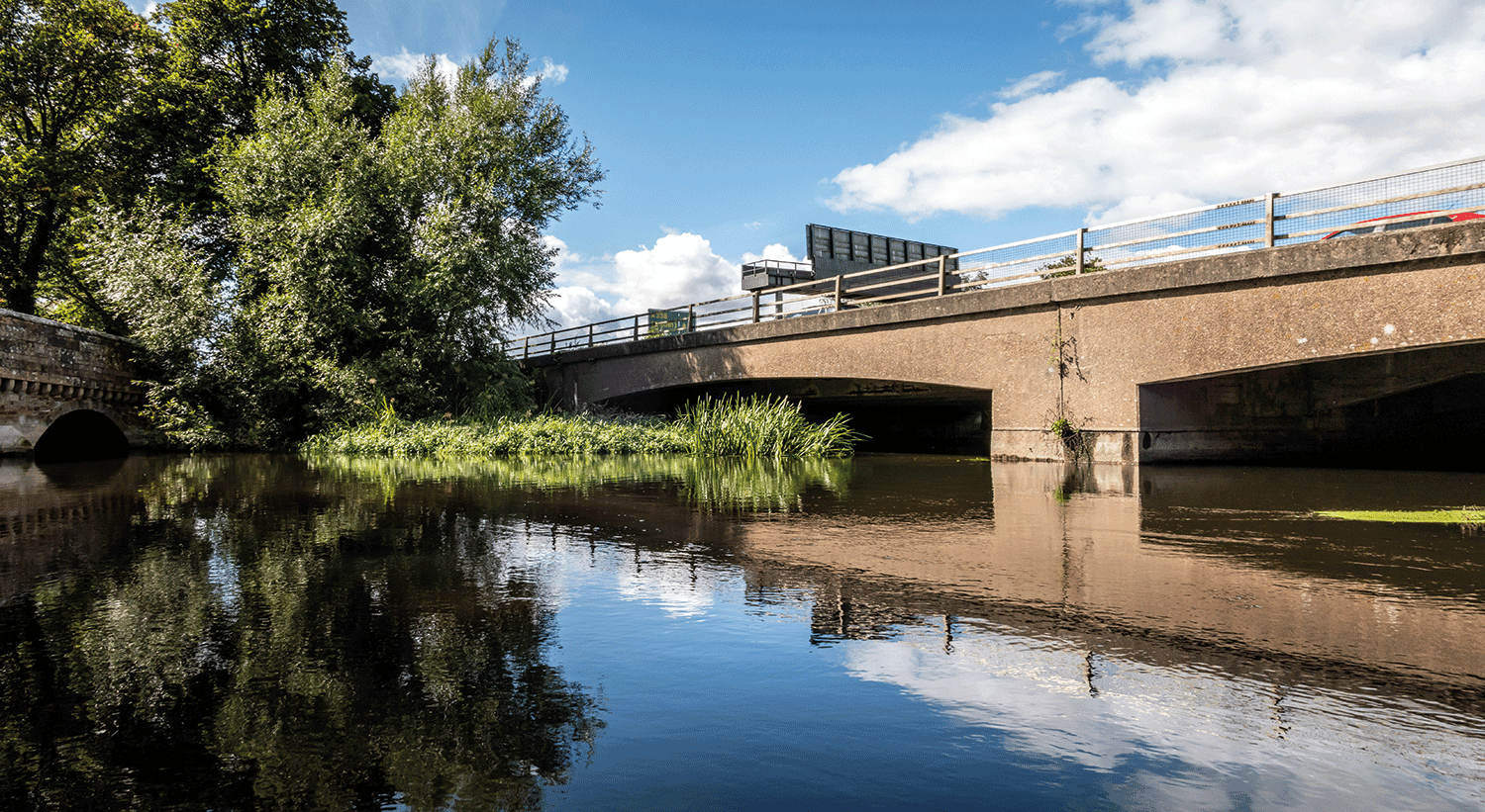 bridge reflected on the surface of the rive