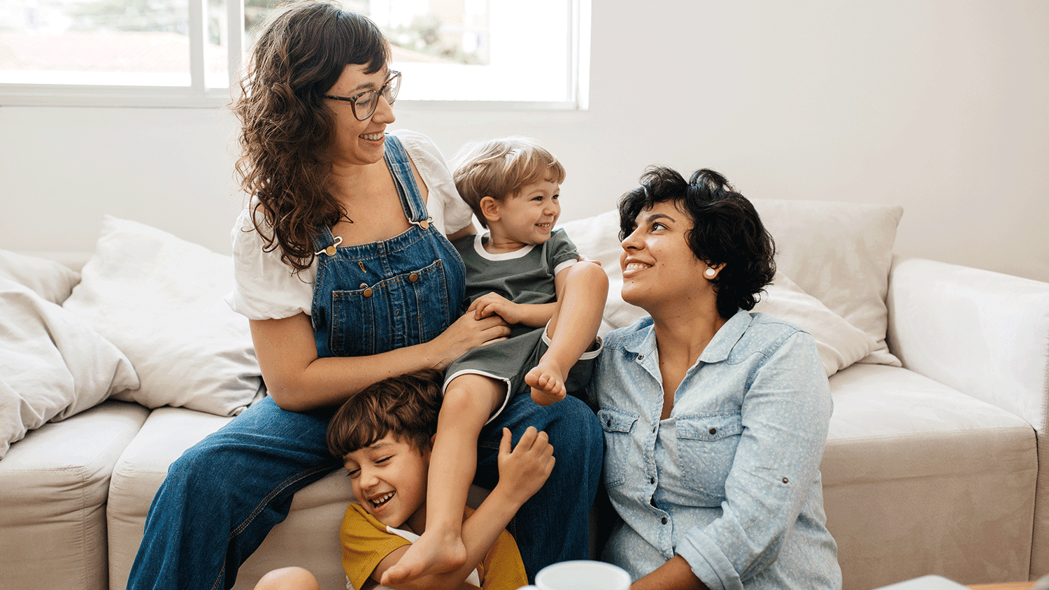 Mothers playing with their two children