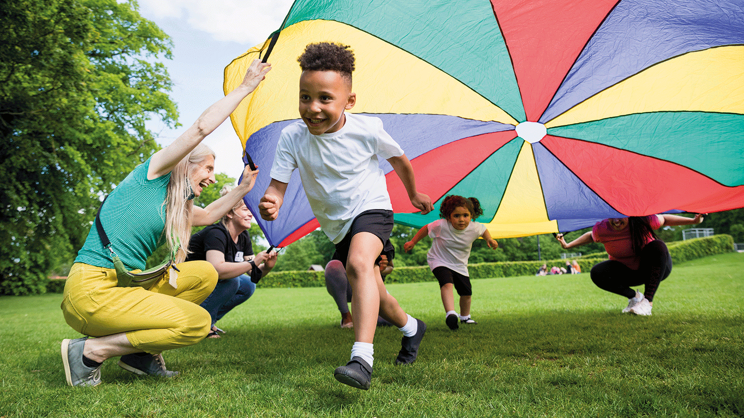 A young child running and playing