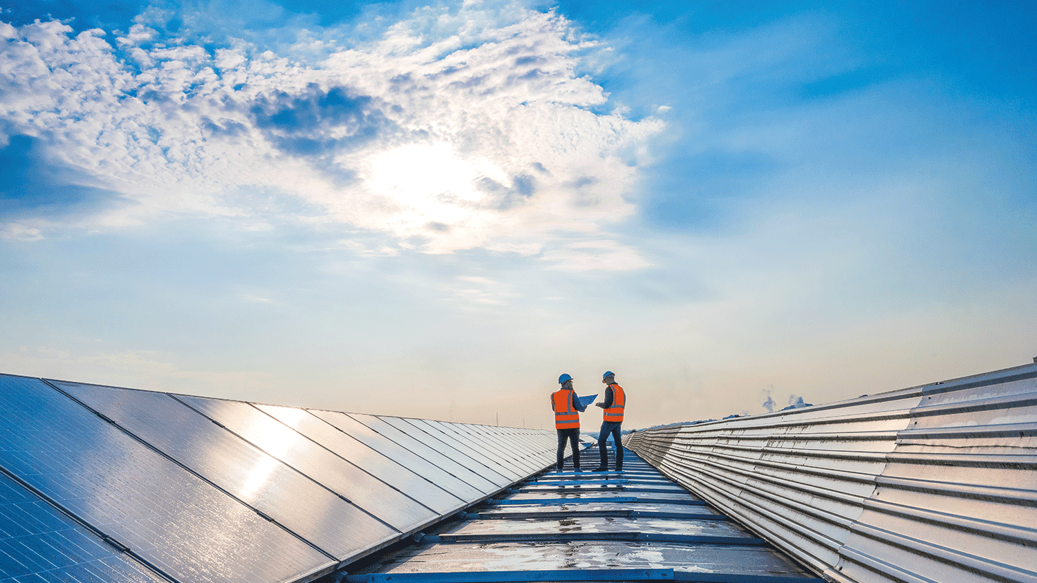 People work on solar panels