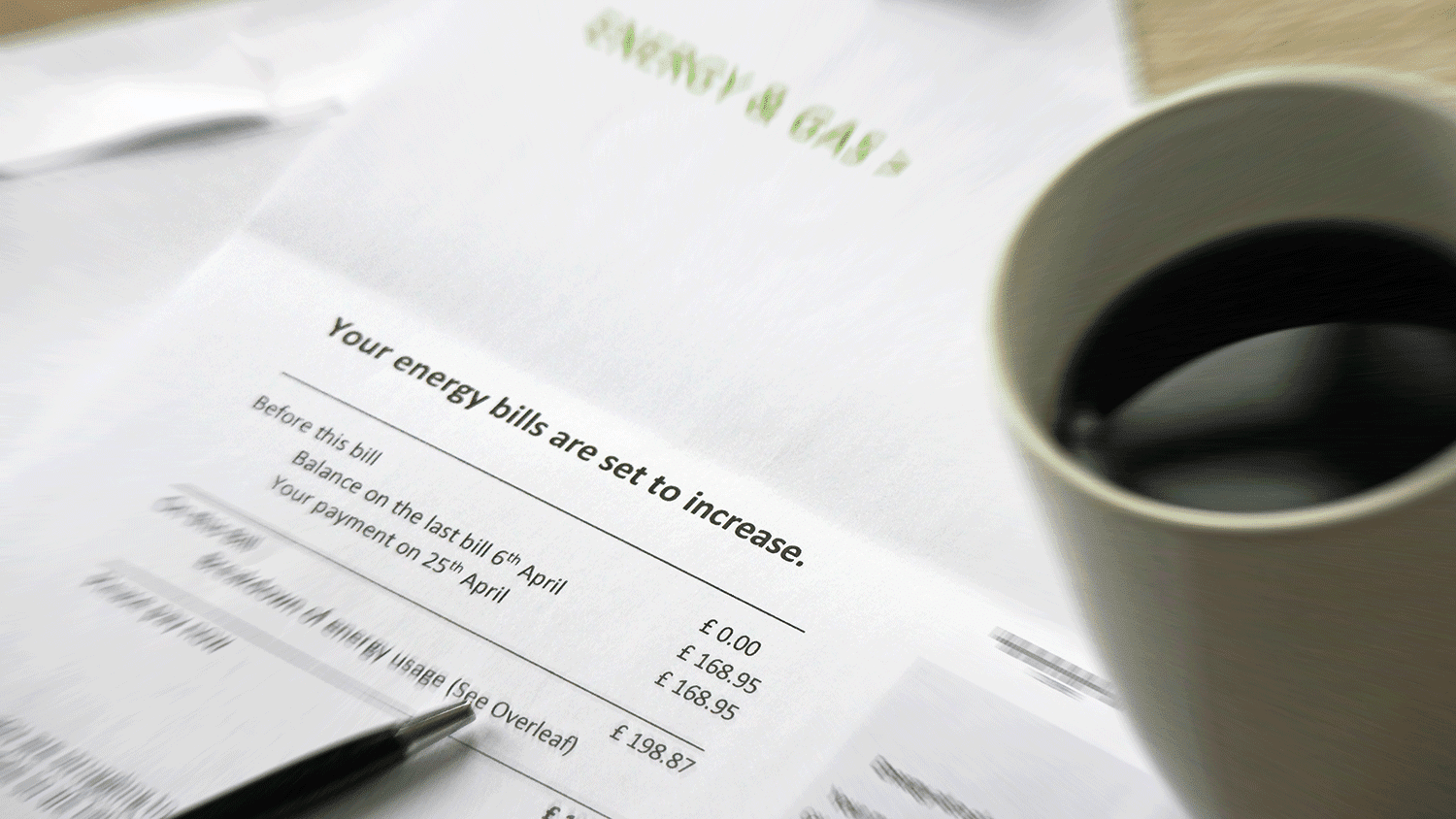 a printed bill and a cup of coffee