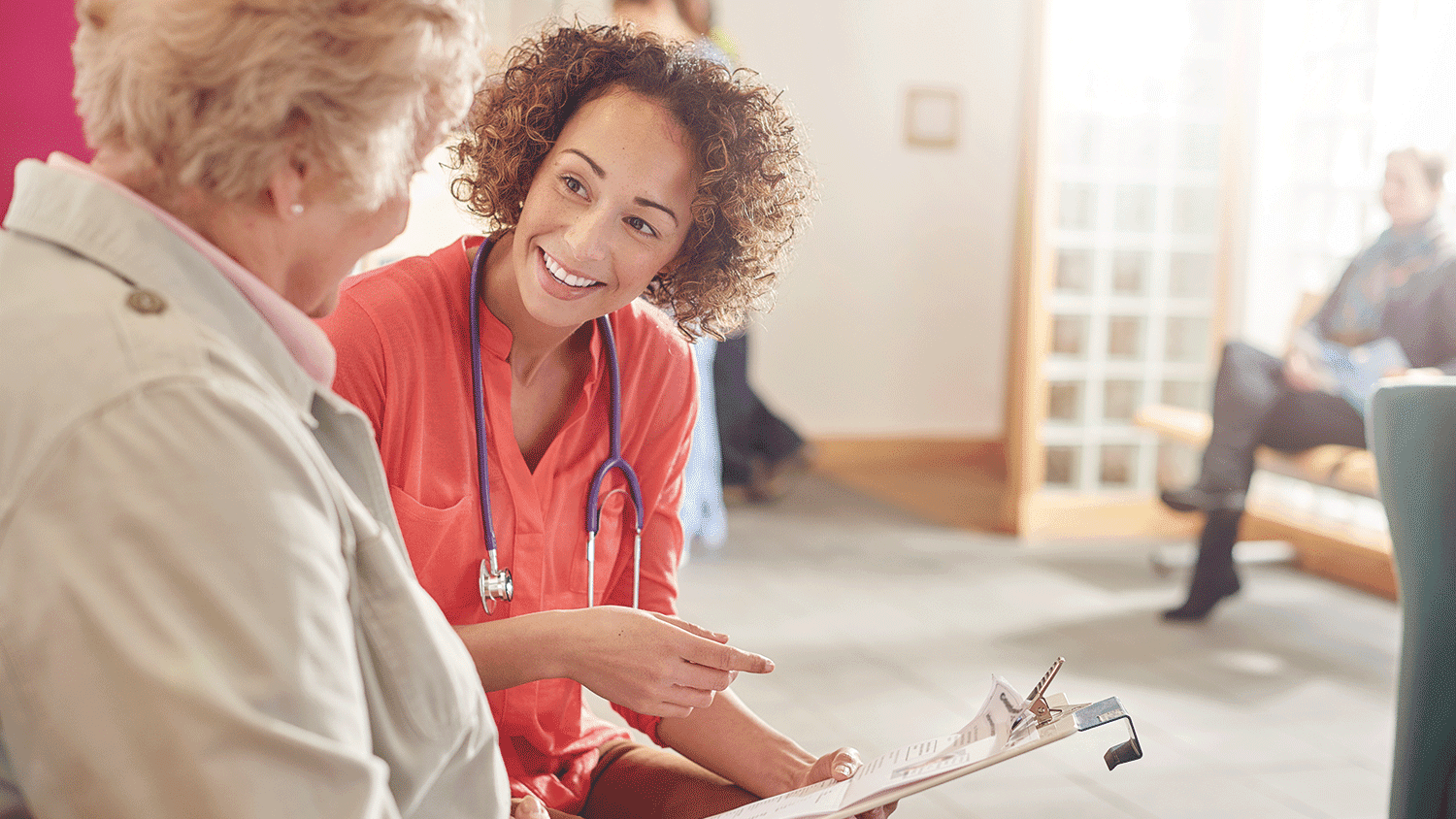 elderly woman with a nurse