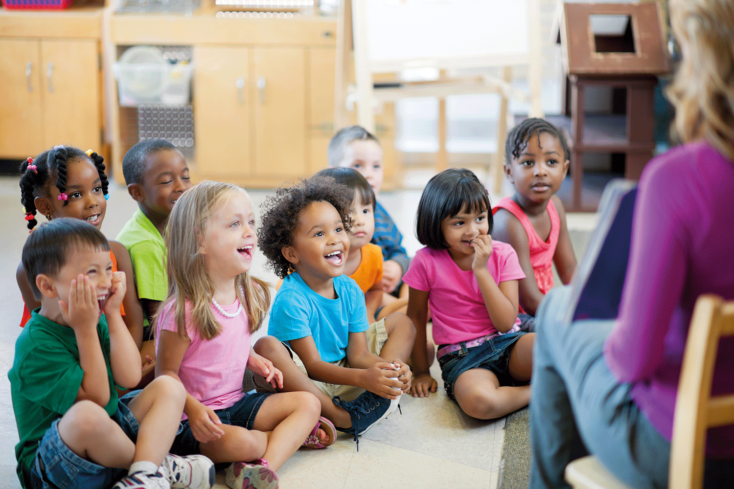 Group of children listening to a story teller