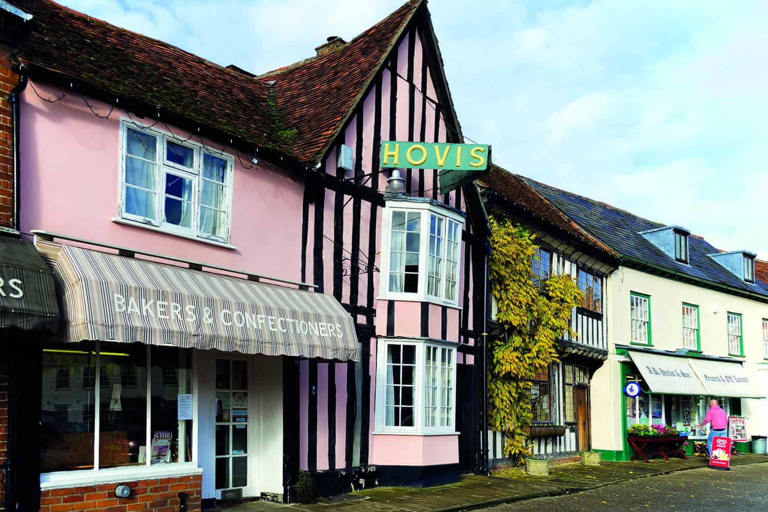 A village shop front with Bakers and Confectioners on the sign