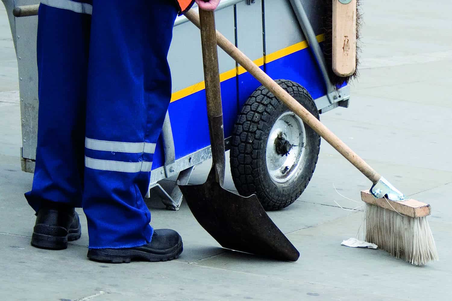 Street cleaner sweeping street