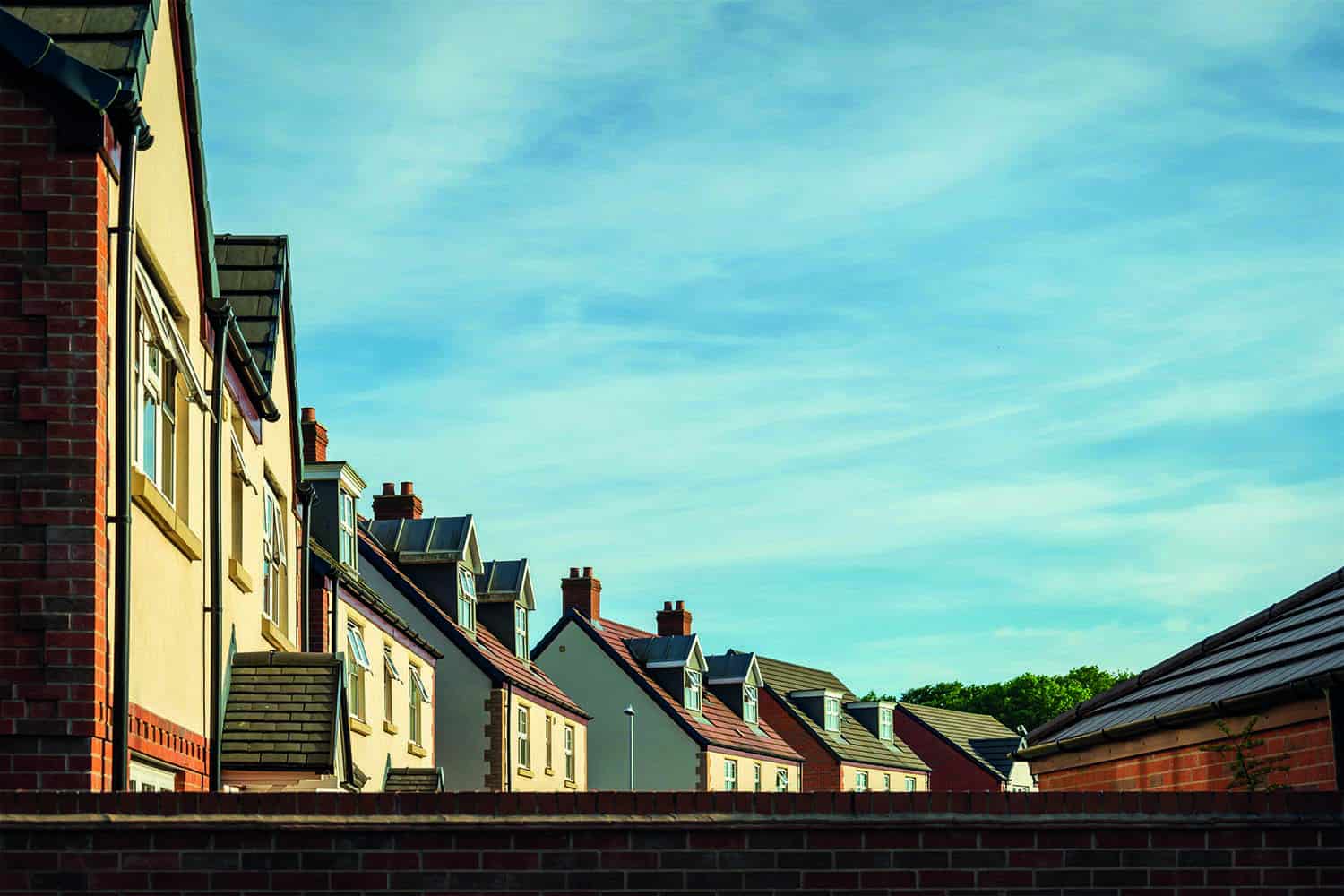 View of new housing over wall