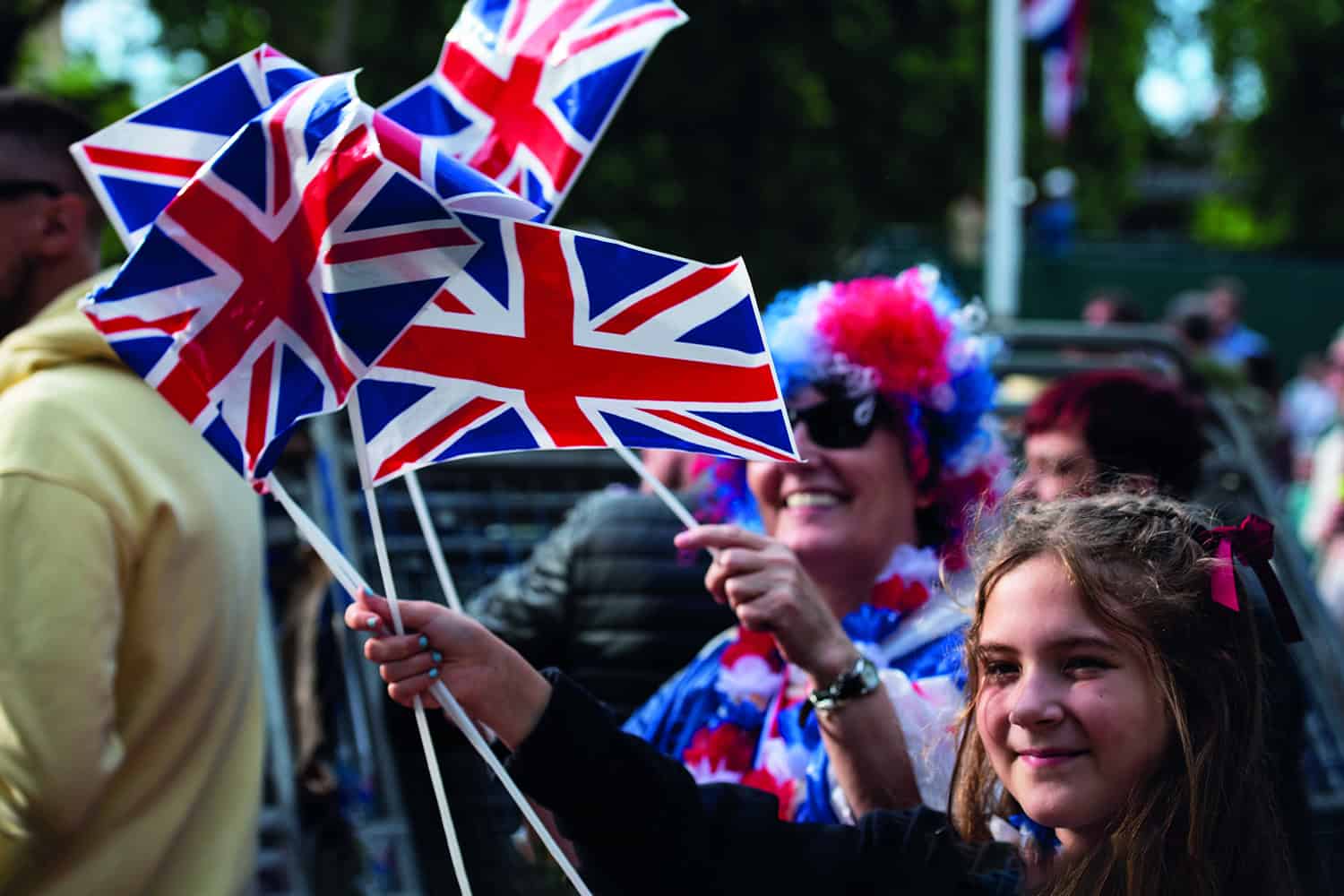 : crowd waving union flags