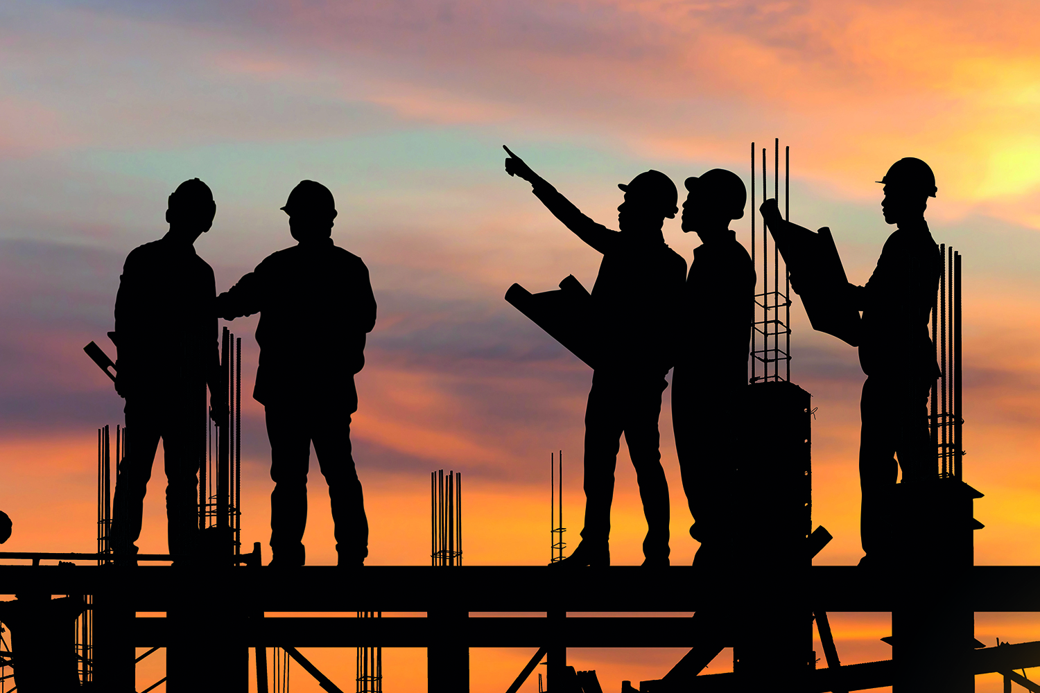 Silhouette of workers on a construction site