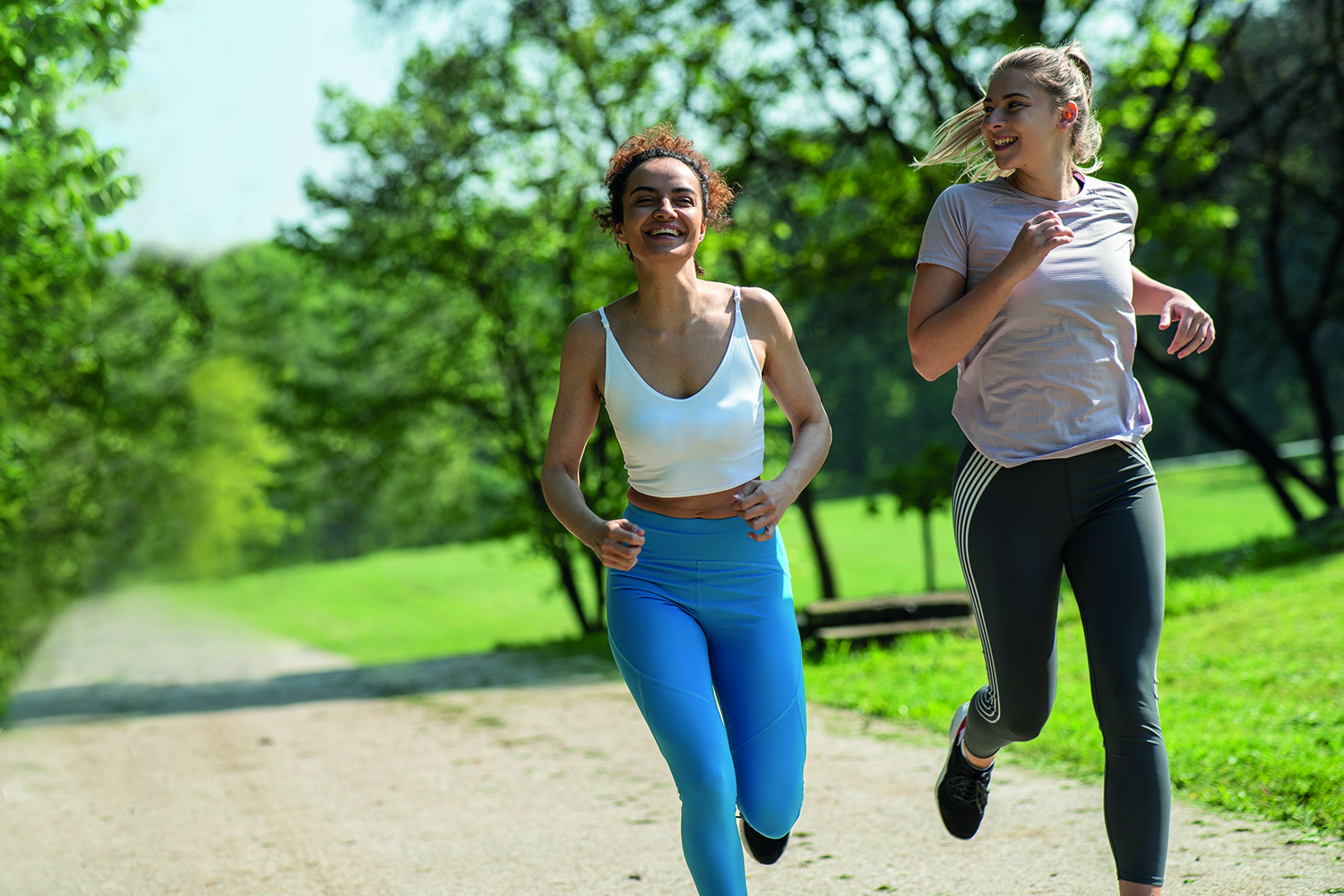 Two women jogging in a park