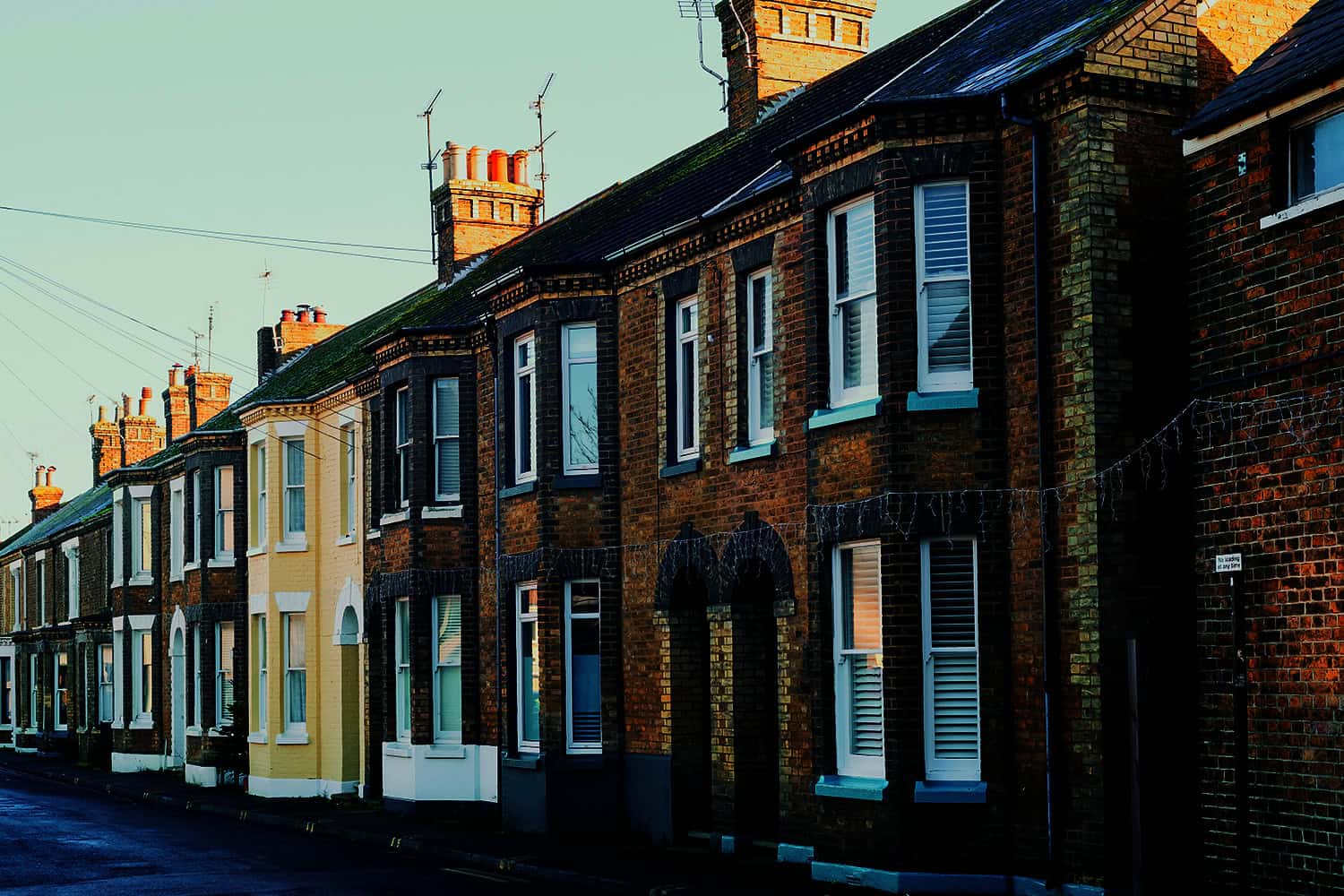 A street of semi-detached brick houses