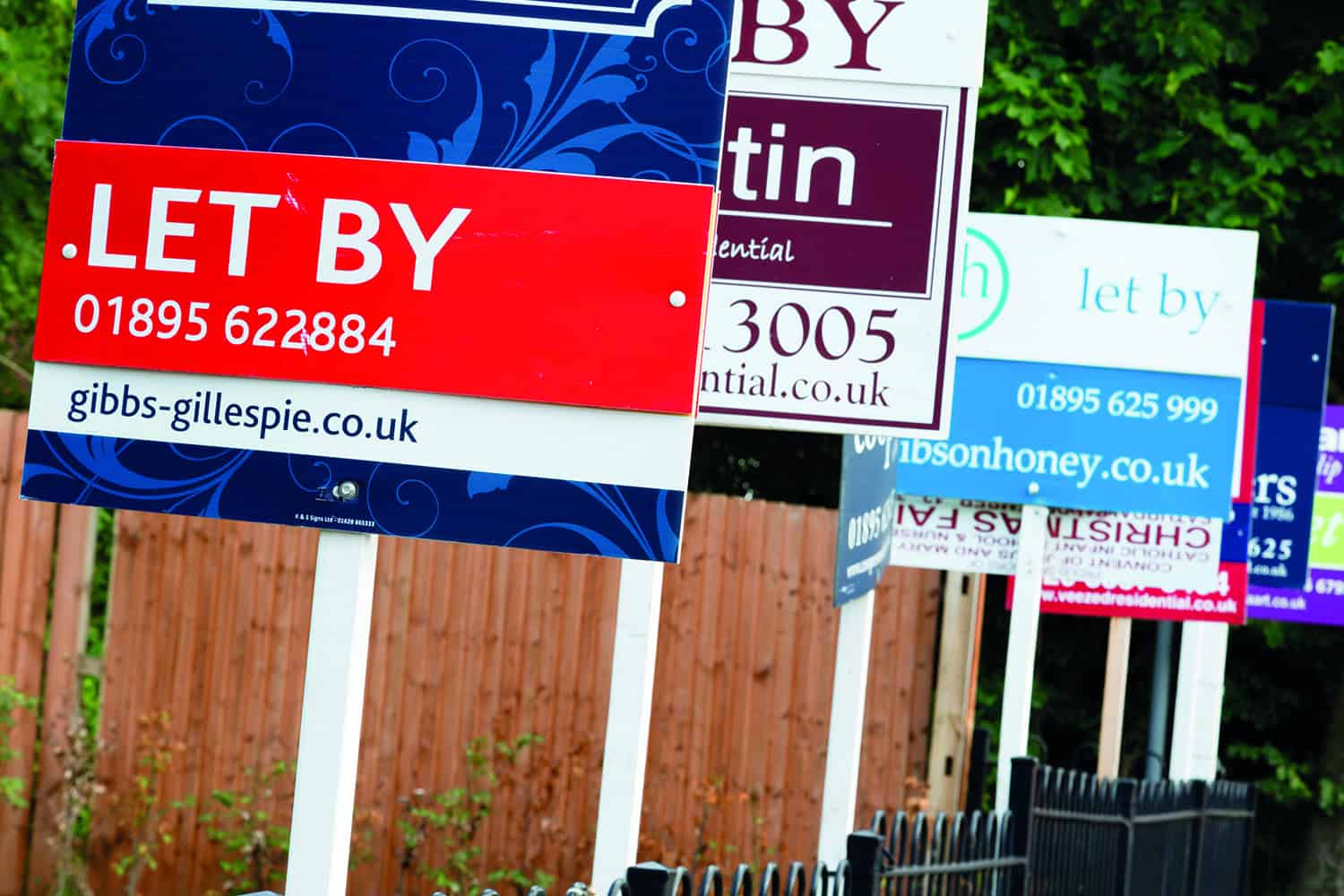 A number of advertising rental boards.