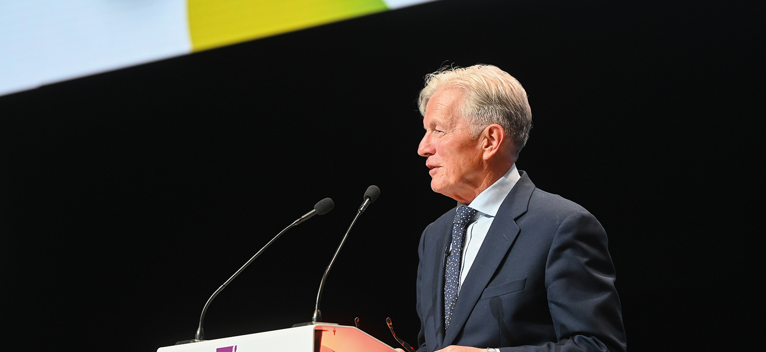 photo of Lord Amyas Morse, Interim Chair of Oflog, standing and speaking at the LGA’s annual conference.