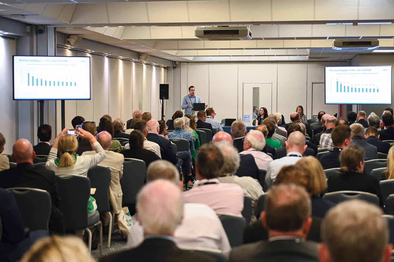 ; photo of delegates and speaker David Phillips, also of the Institute for Fiscal Studies, at an LGA annual conference session on local government finance,