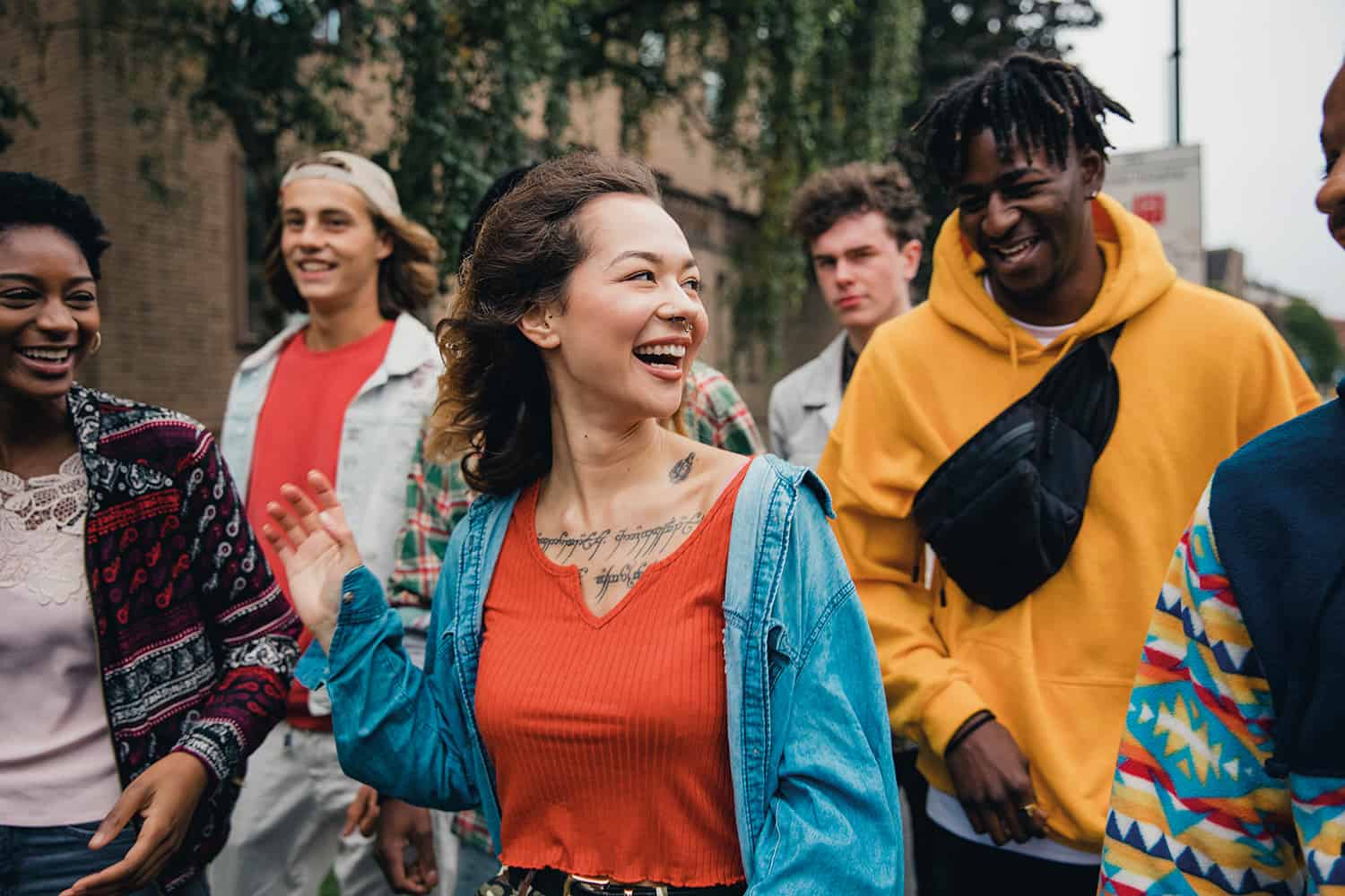 mixed group of young people walking and chatting