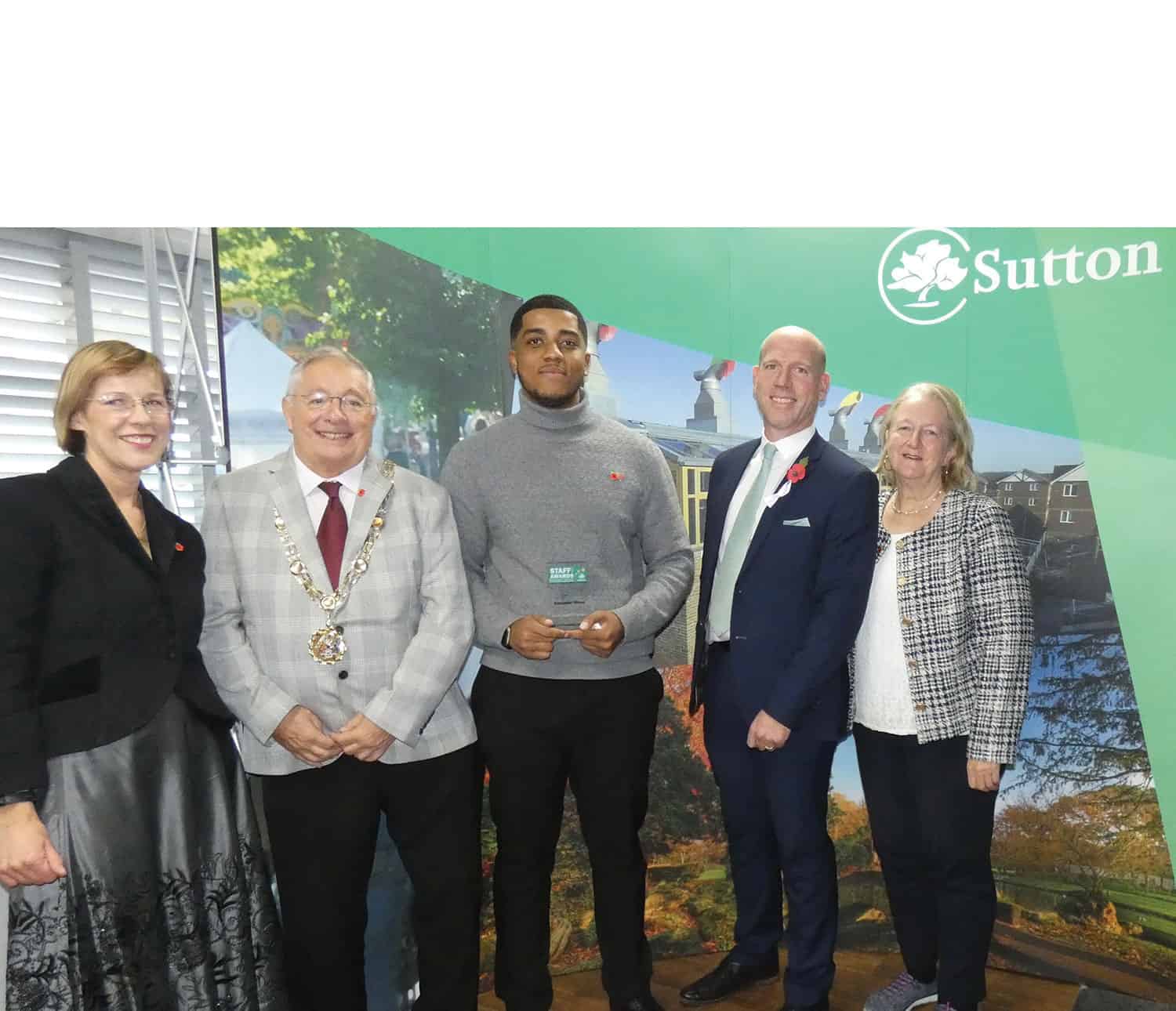 Alexander Virtue, an NGDP trainee stood with Helen Bailey, Chief Executive of Sutton Council, Cllr Colin Stears, Mayor, Spencer Palmer, Strategic Director of Environment, Housing and Neighbourhoods and Council Leader Councillor Ruth Dombey