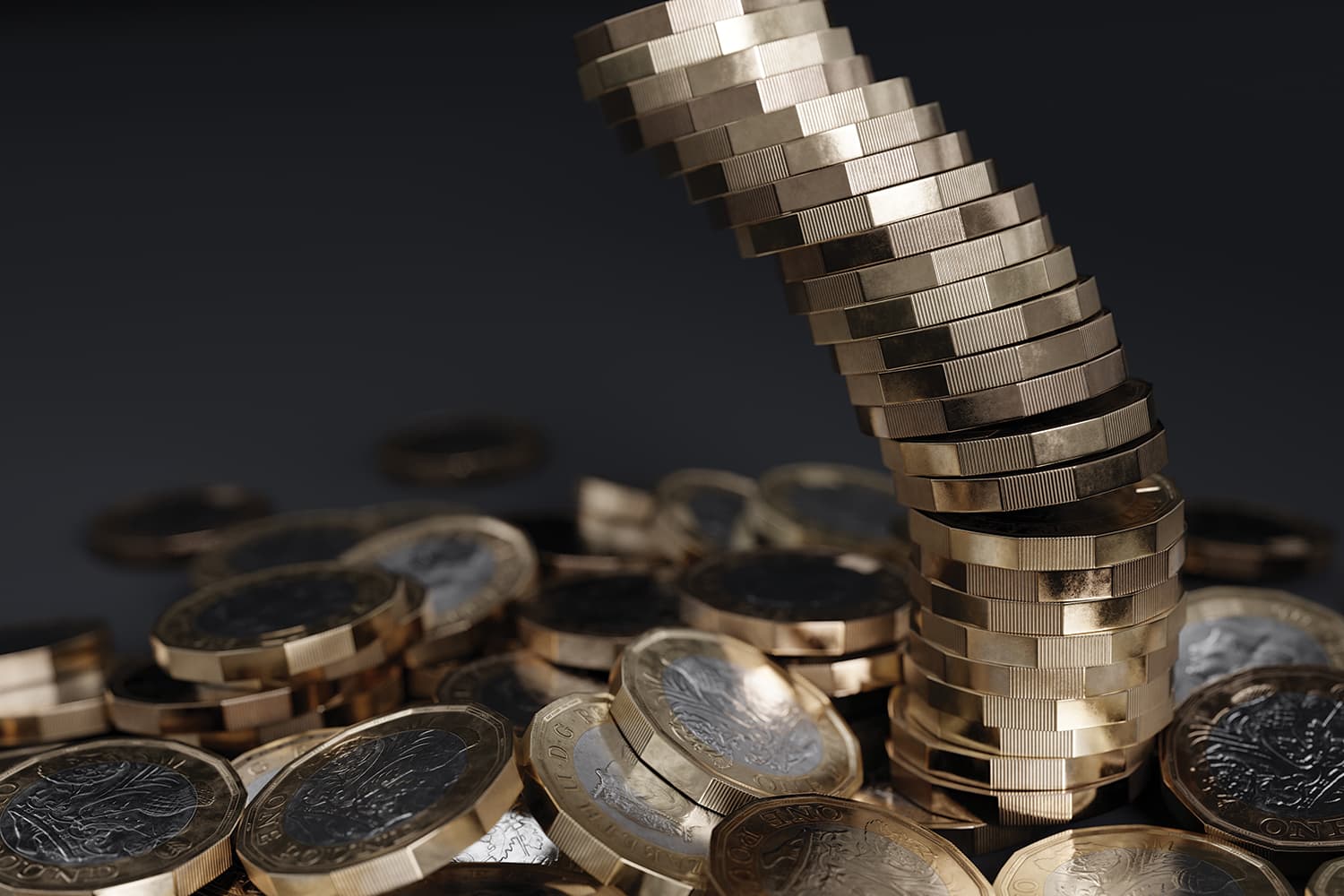 photo of tower of shiny new pound coins about to collapse onto coins below