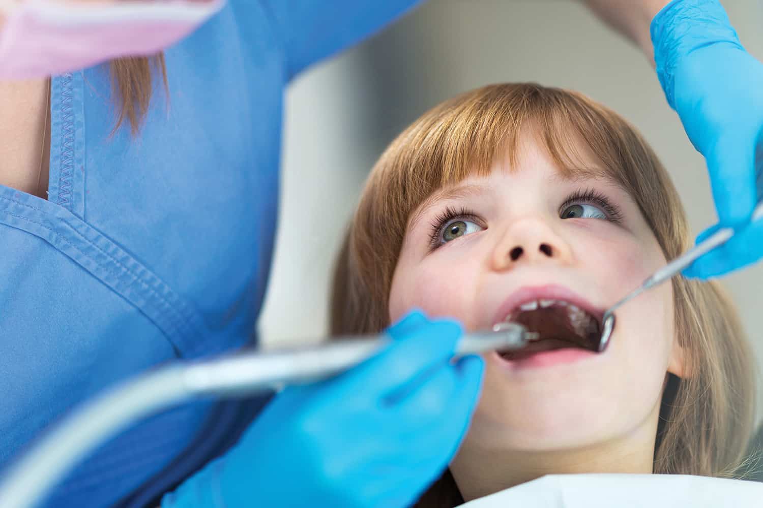 photo of young girls with mouth open l