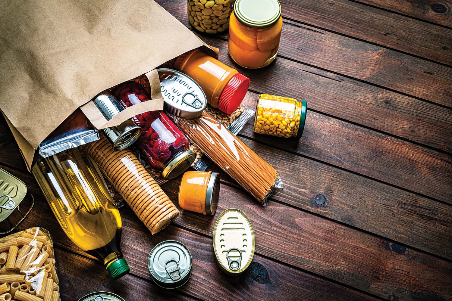 photo of groceries spilling out of brown paper shopping bag