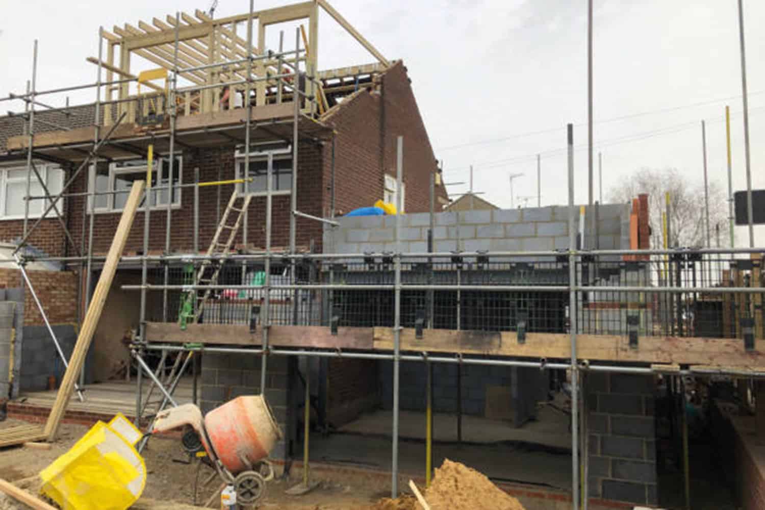 photo of private home, end of terrace undergoing loft extension works and side extension